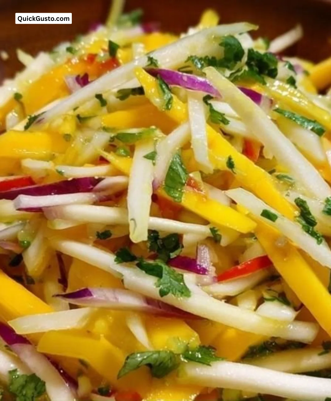 Colorful spicy mango and jicama slaw served in a bowl