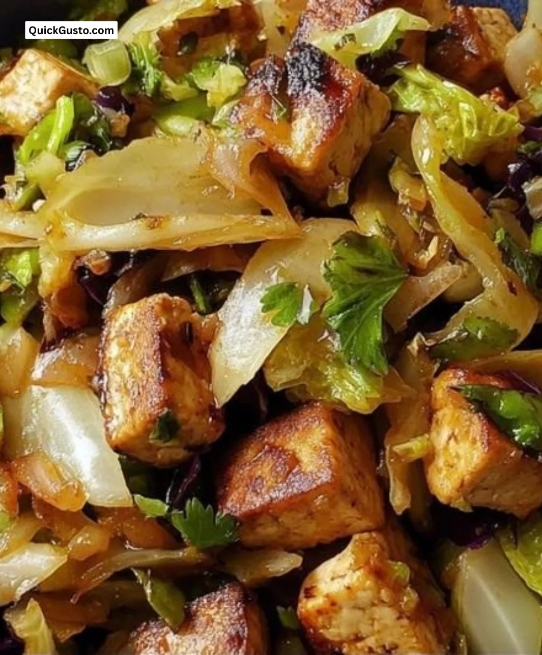 Delicious stir-fried tofu and cabbage dish served in a bowl.