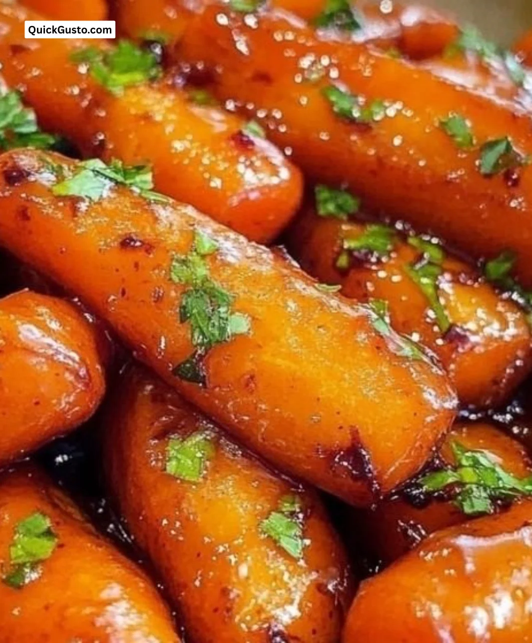 Plate of sweet honey glazed carrots garnished with herbs