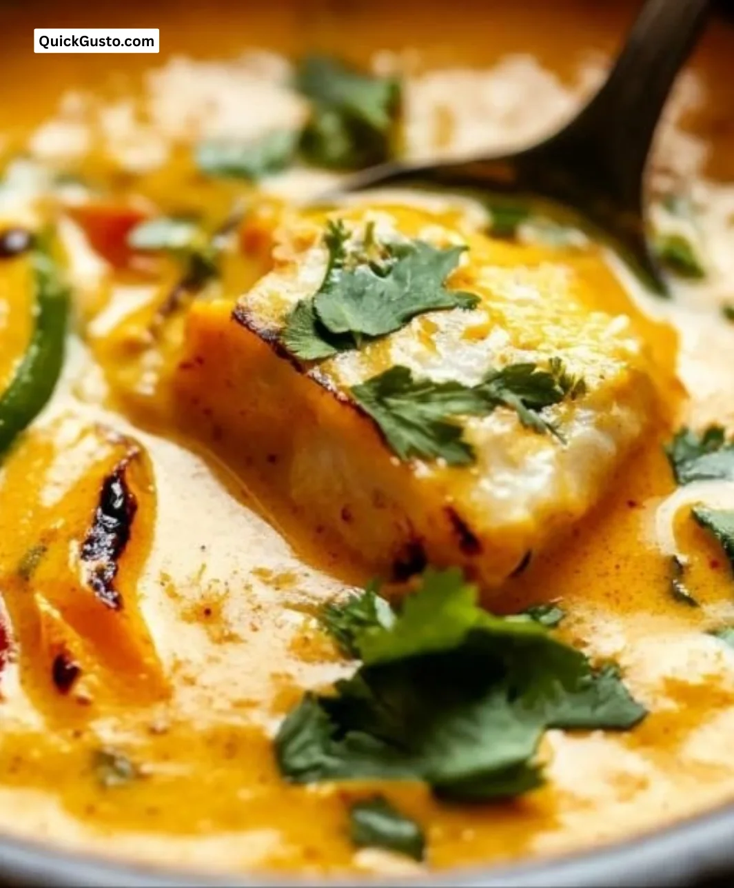 Bowl of Thai Pumpkin Soup garnished with herbs and spices