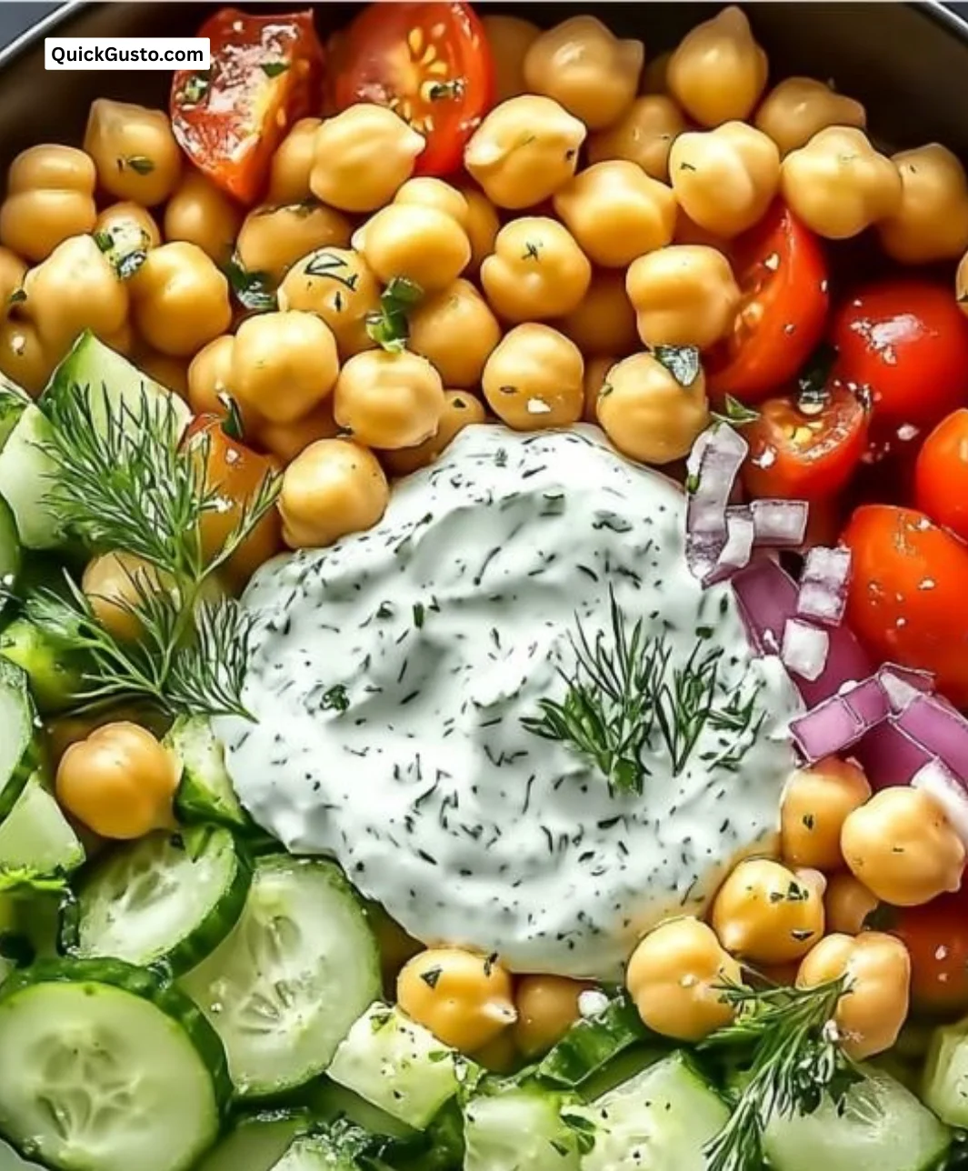 Tzatziki Chickpea Salad with cucumbers and herbs in a bowl
