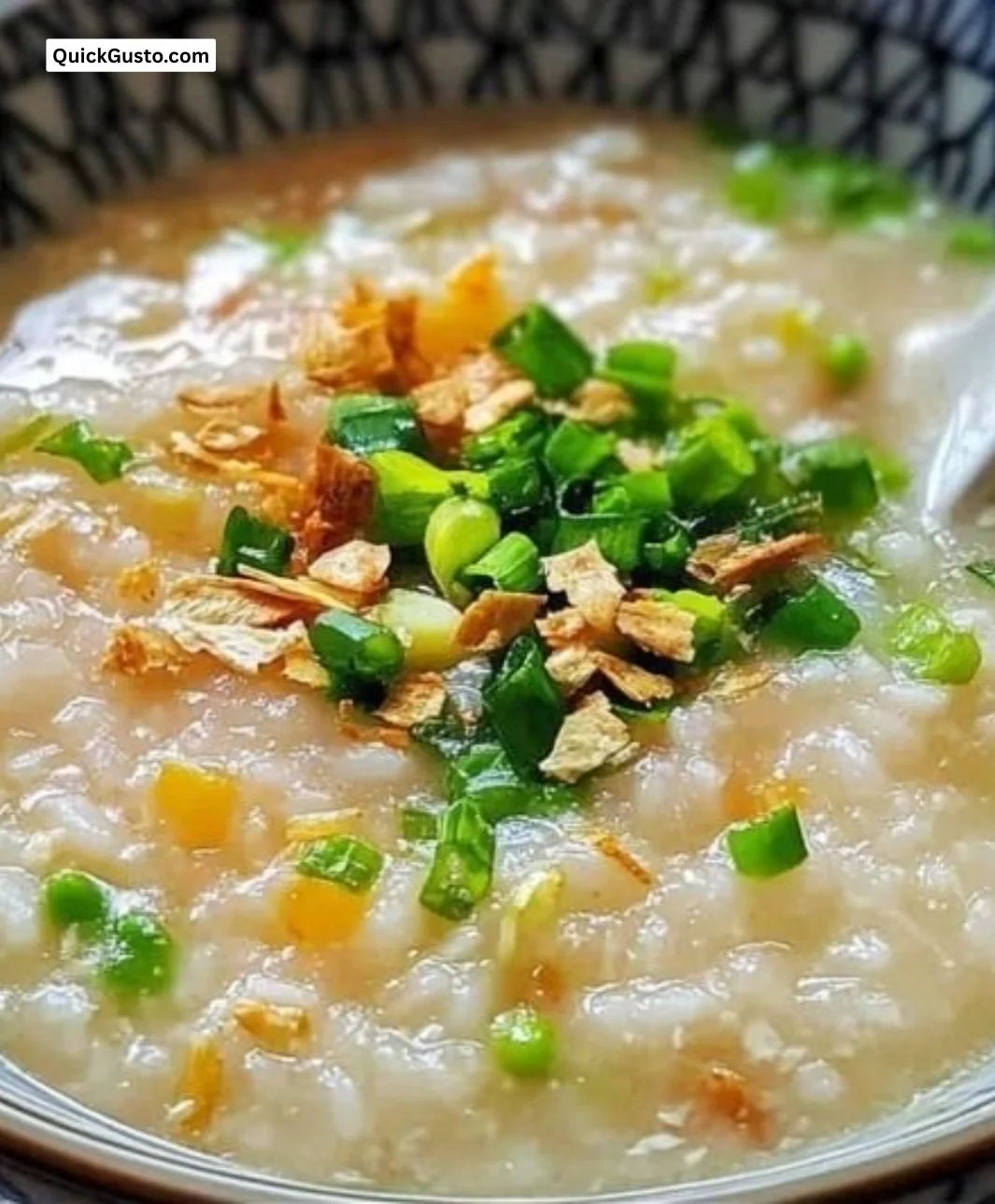 Bowl of Veggie Rice Congee topped with fresh herbs and vegetables