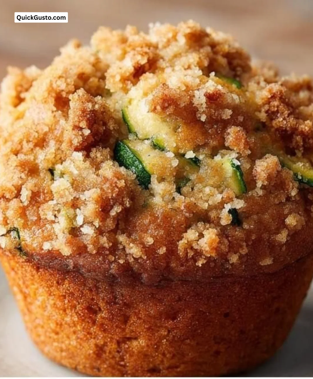 Delicious zucchini muffins topped with a crunchy streusel topping