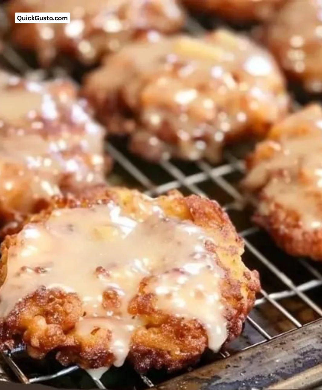 Delicious baked apple fritters topped with glaze and cinnamon sugar