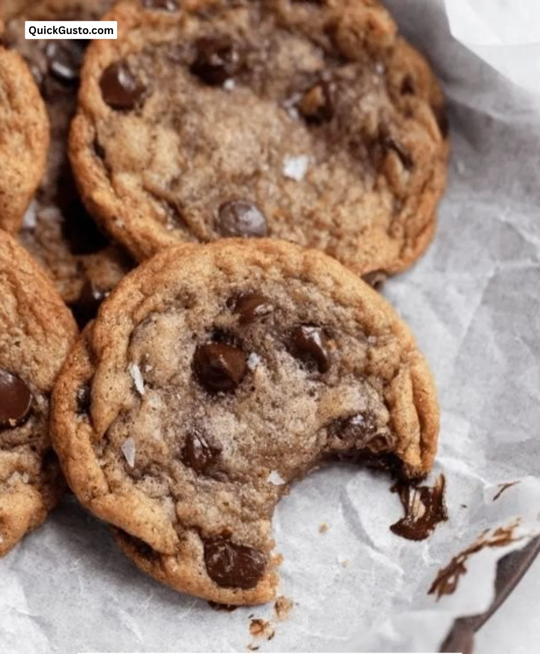 Freshly baked banana chocolate chip cookies on a cooling rack