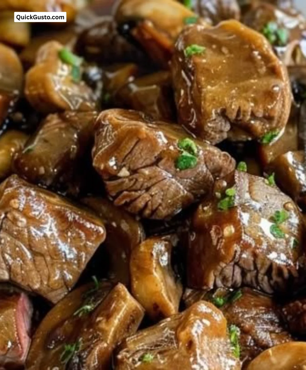Beef tips served in savory mushroom gravy on a plate