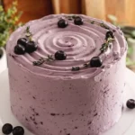 Delicious Blueberry Chiffon Cake served with fresh blueberries and whipped cream.