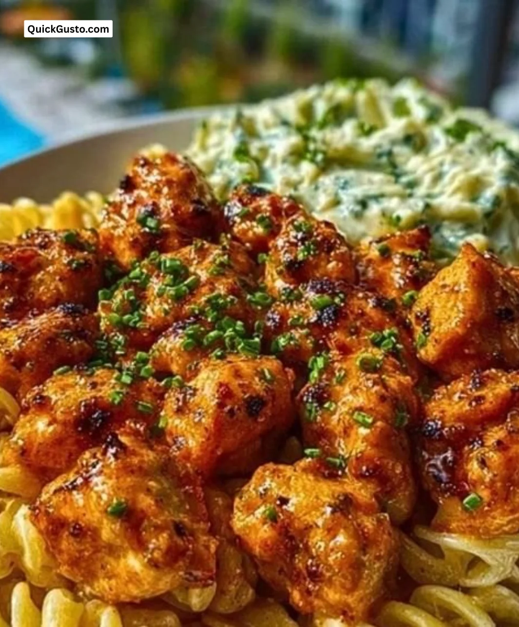 Buffalo Garlic Chicken Bites served with Ranch Cajun Alfredo Twisted Pasta