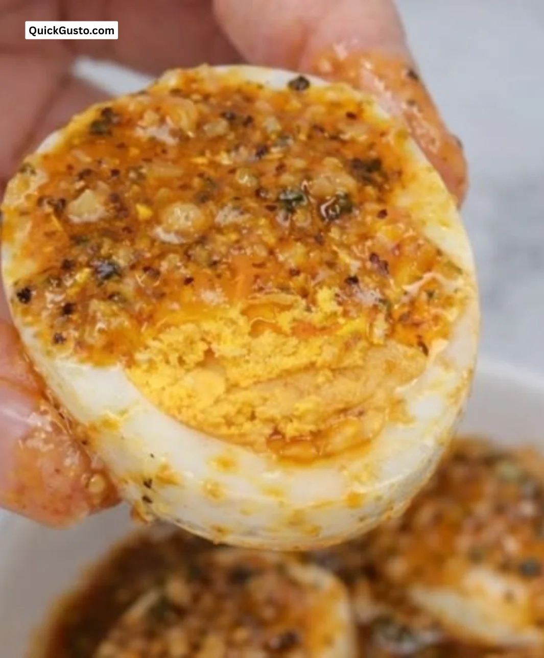Spicy Cajun Boiled Eggs served on a plate, garnished and ready to enjoy