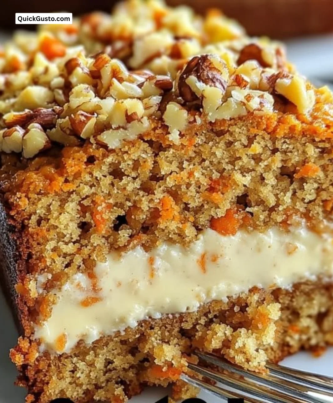 Delicious carrot cake loaf sliced and served on a wooden board