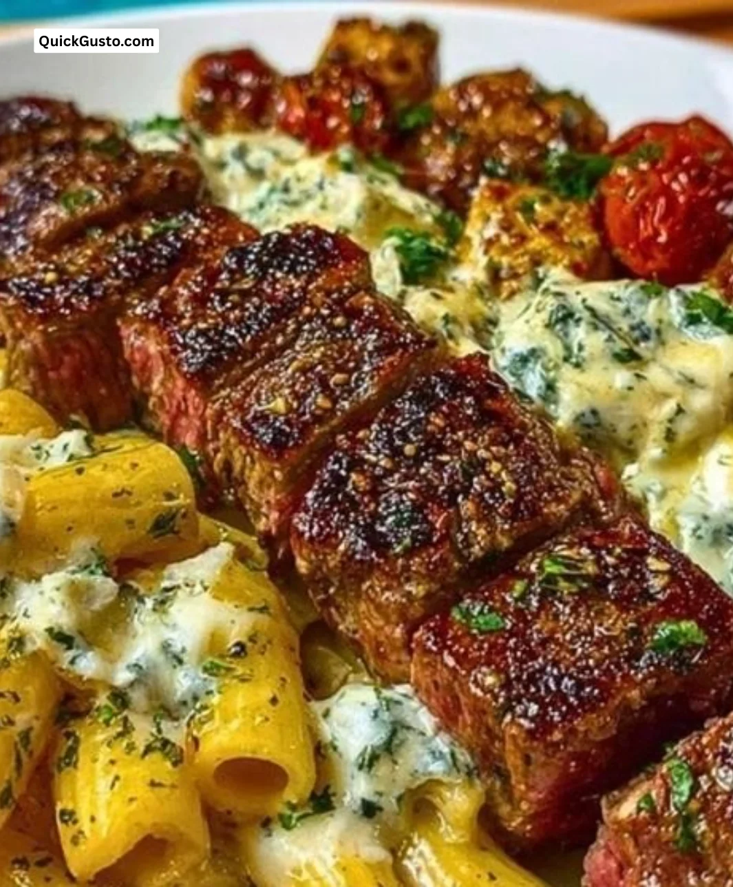 Delicious Cheesy Garlic Butter Steak served with Rigatoni and Four-Cheese Sauce