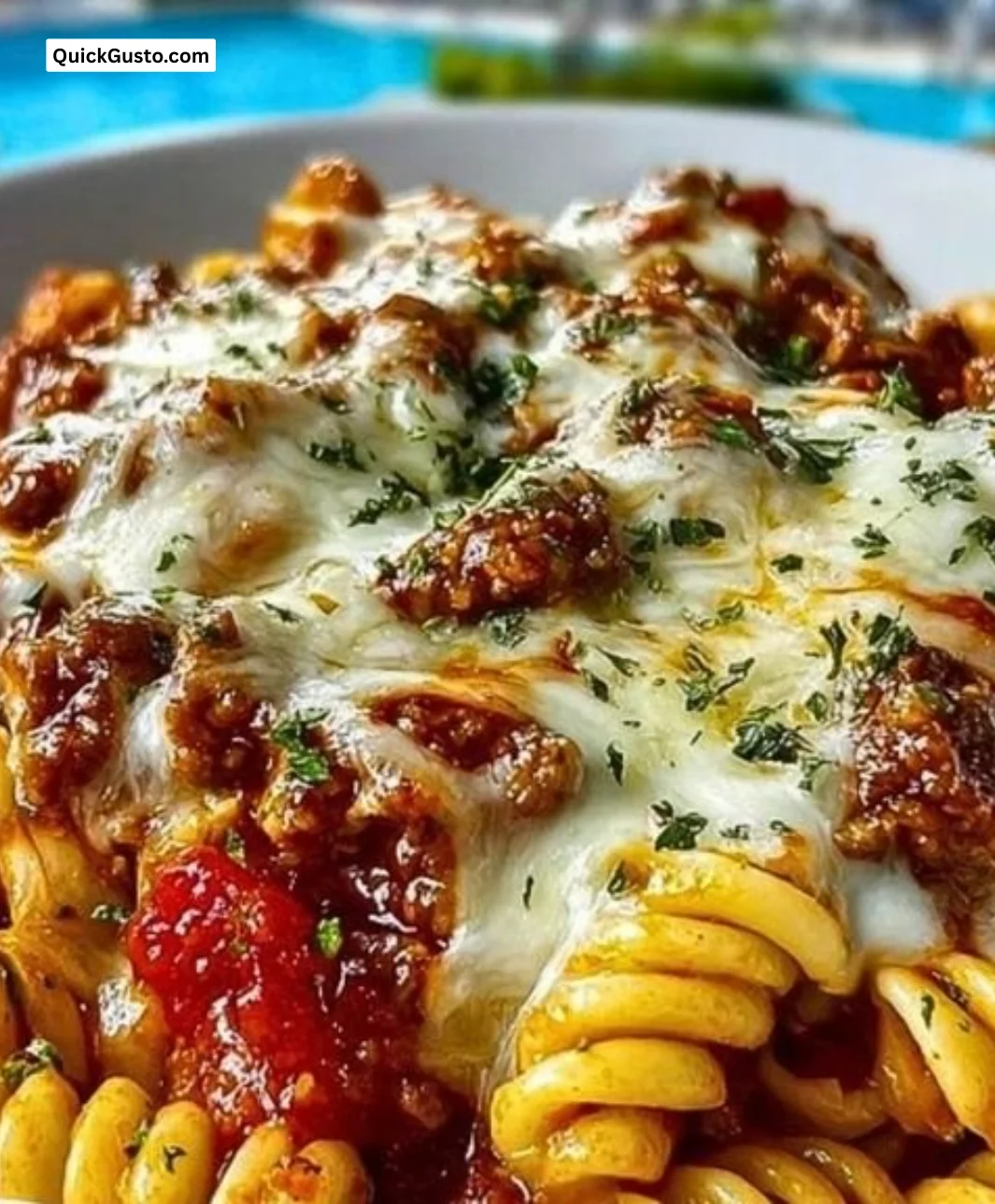 Cheesy Velveeta Rotini with Italian Beef Marinara served in a bowl