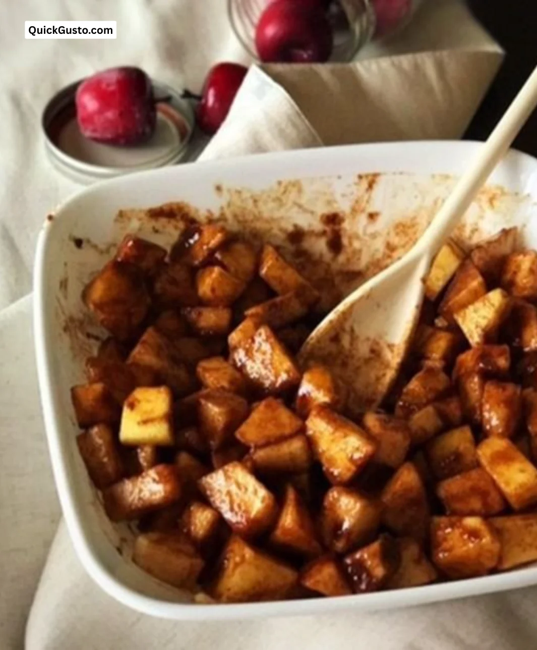 Bowl of cinnamon apples served with caramel ice cream
