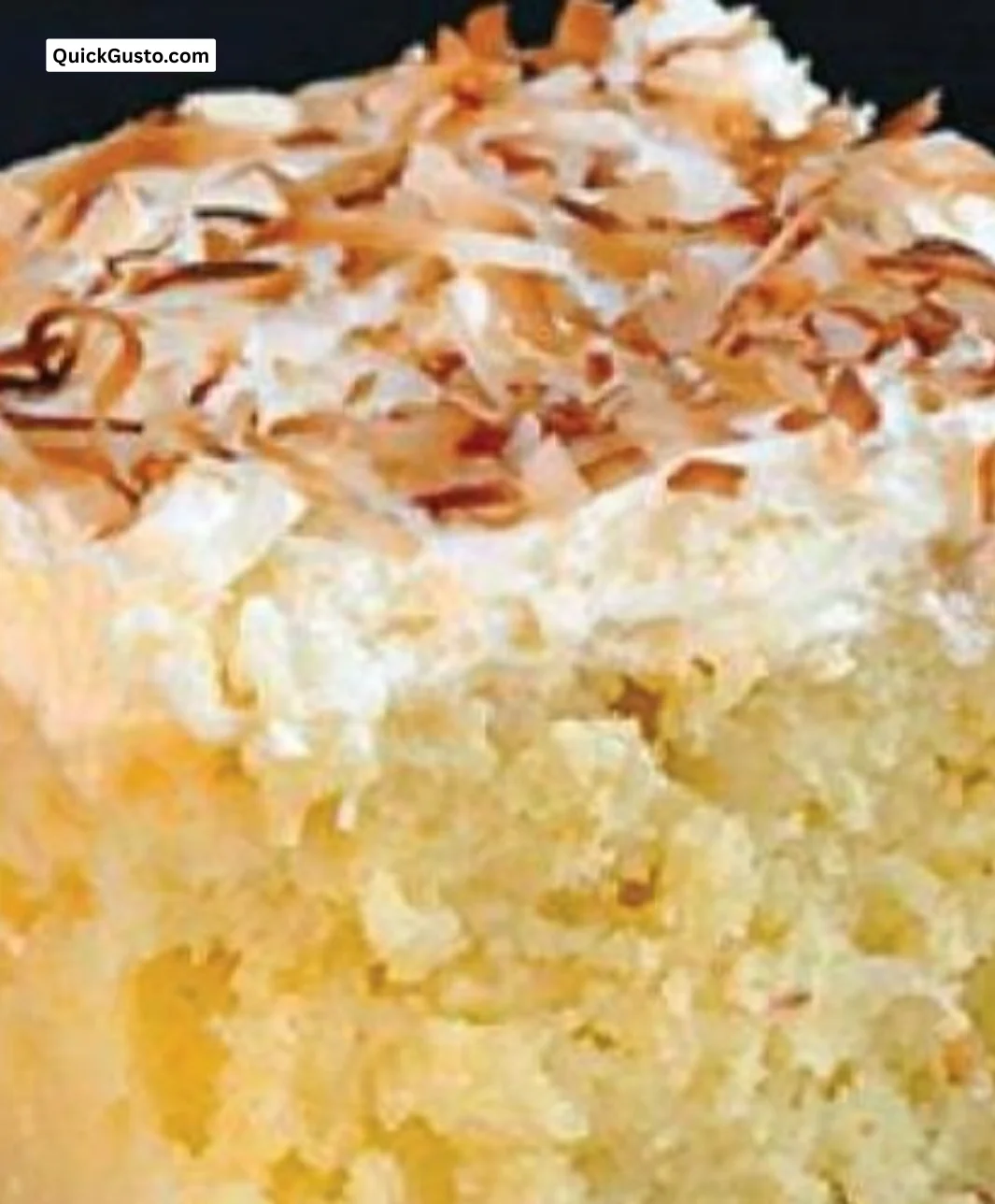 Delicious slice of coconut cake topped with creamy coconut frosting.