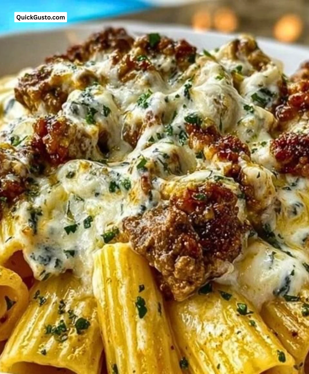 Creamy cheesy garlic butter rigatoni with savory beef in a bowl