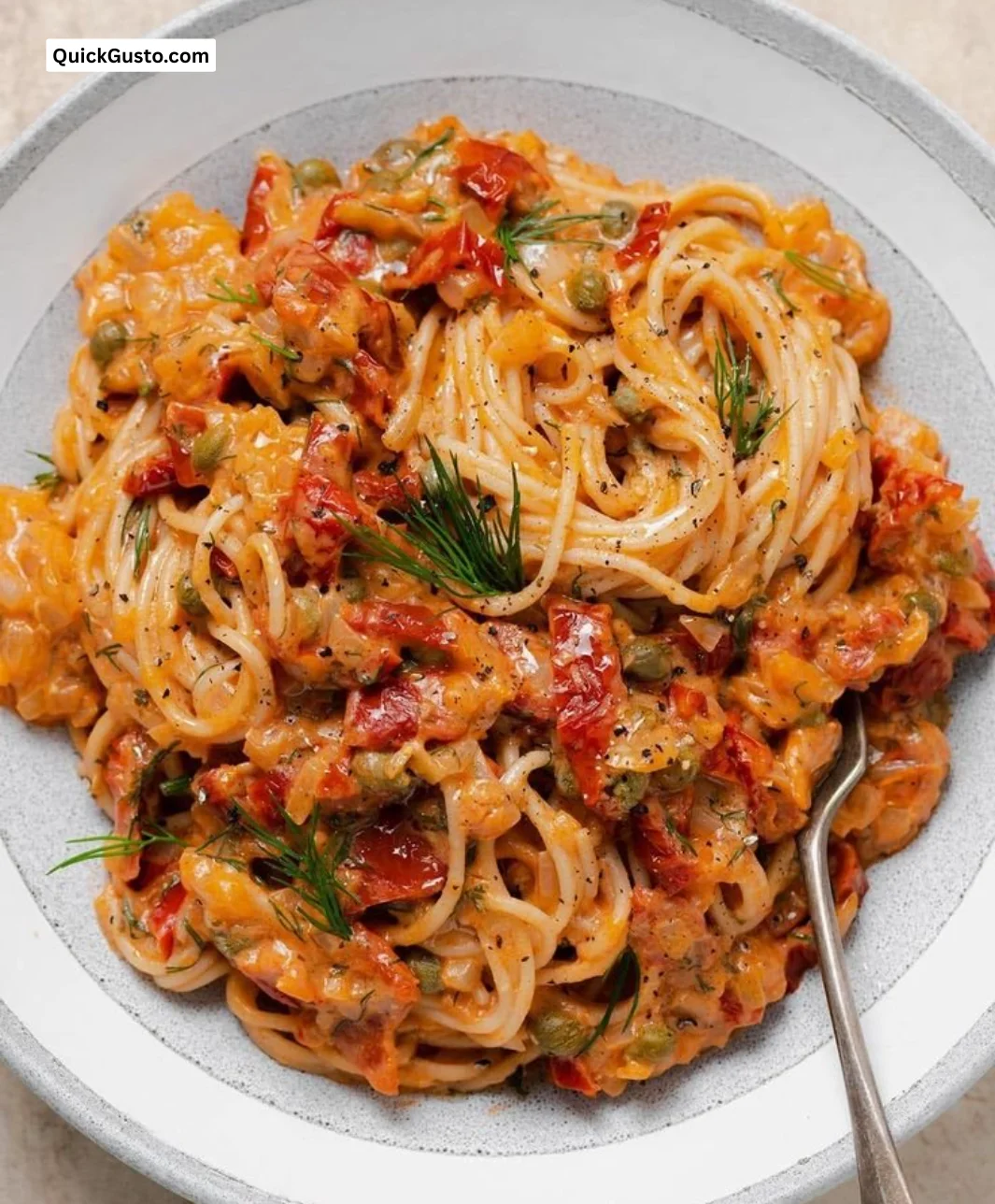 Creamy sun-dried tomato pasta sauce over freshly cooked pasta.