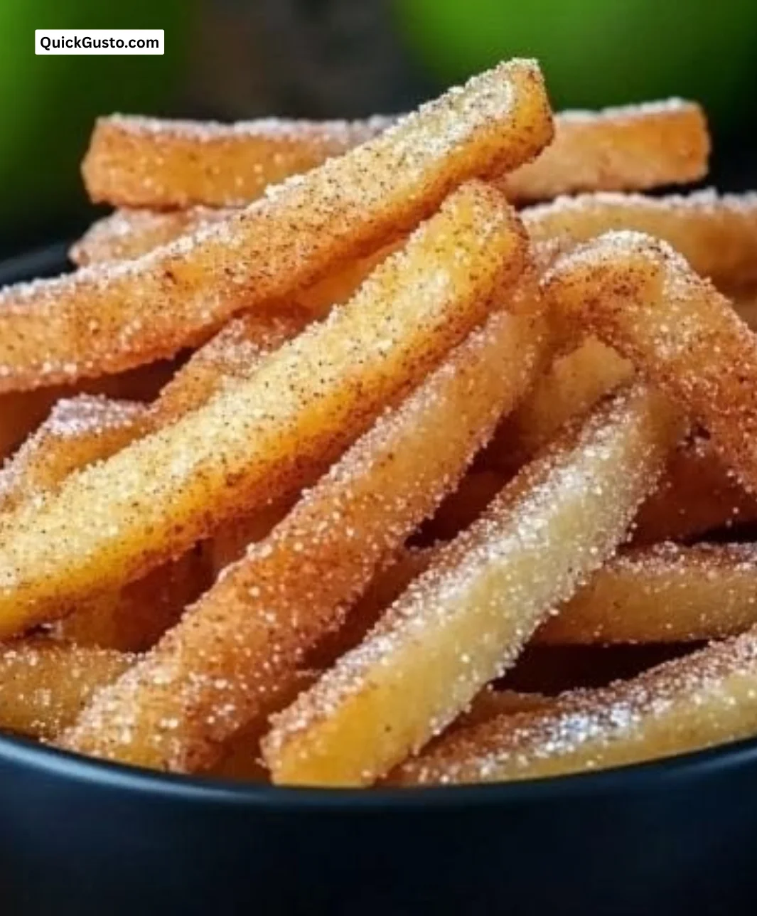 Crispy air fryer apple fries served on a plate, a tasty healthy snack.