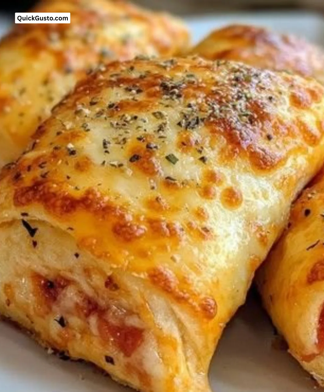Crispy air fryer pizza rolls served with dipping sauce.
