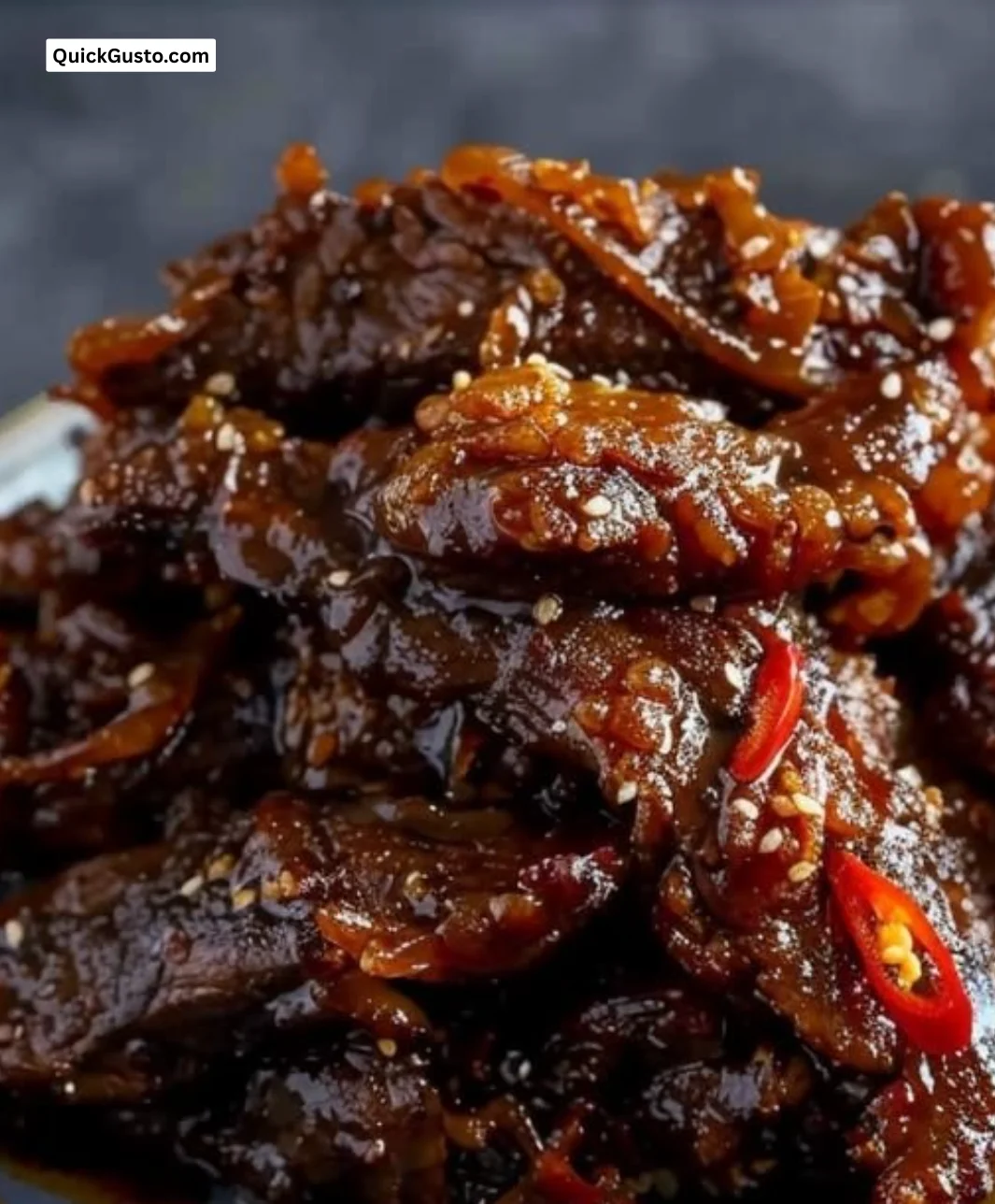 Delicious crispy chilli beef served with vibrant vegetables on a plate