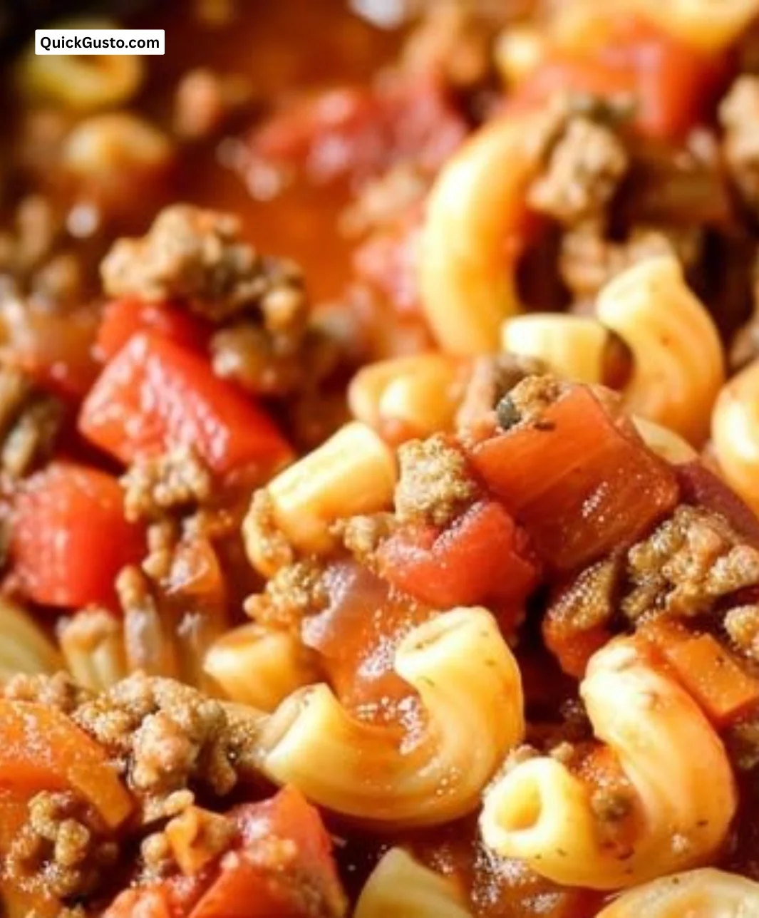 Bowl of hearty Crockpot Goulash with ground beef, pasta, and vegetables