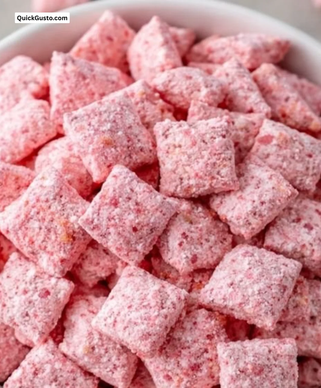 Bowl of Strawberry Shortcake Puppy Chow, a no-bake crunchy treat