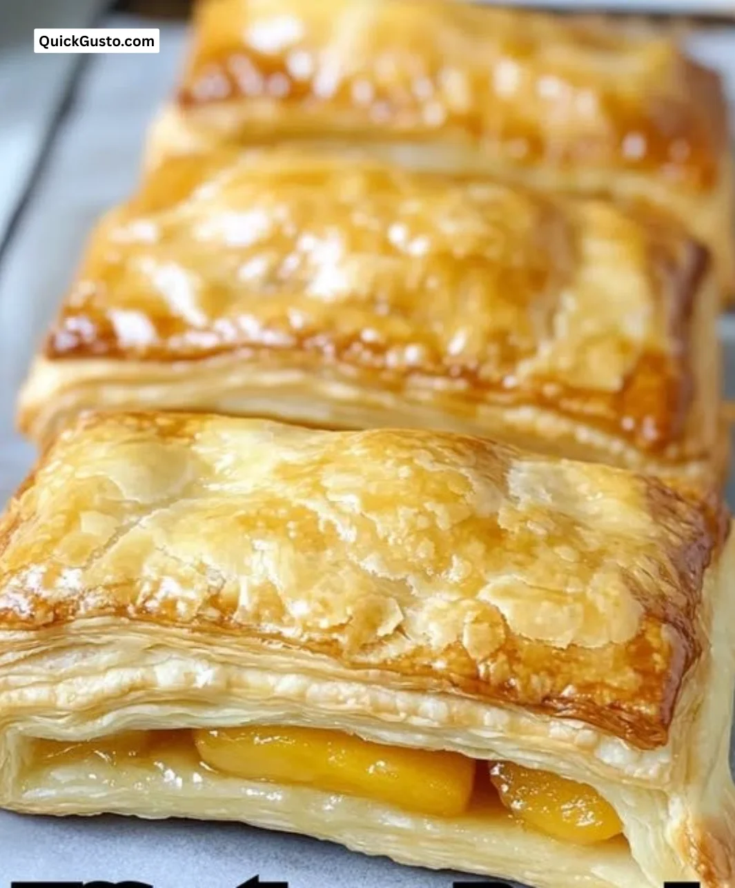 Delicious peach puff pastry ready to serve, showcasing flaky layers and fresh peaches.