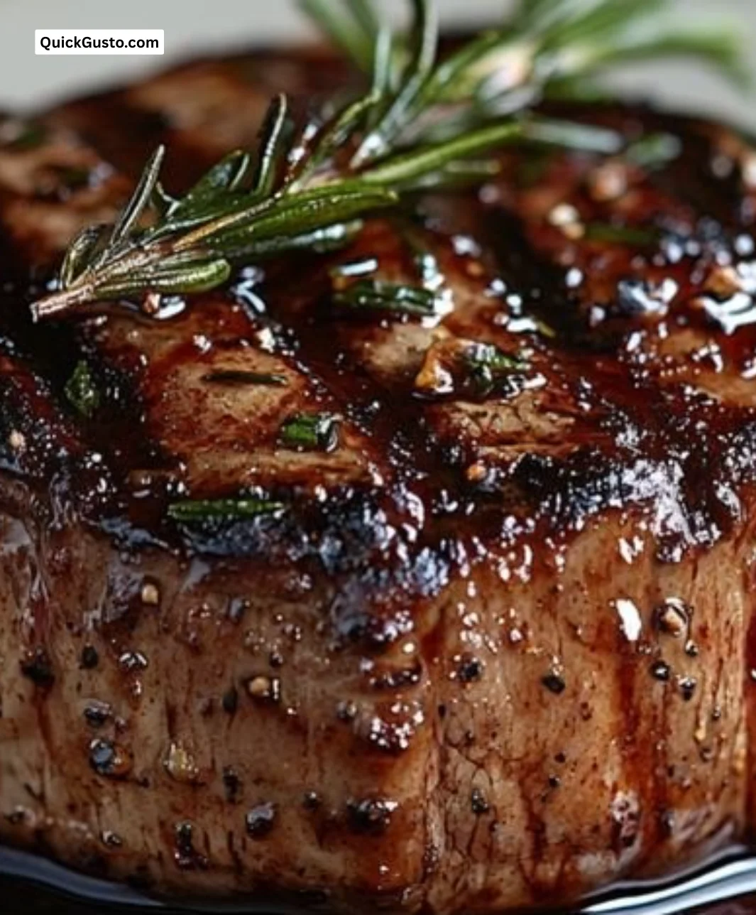 Delicious filet meat paired with rich red wine sauce on a plate