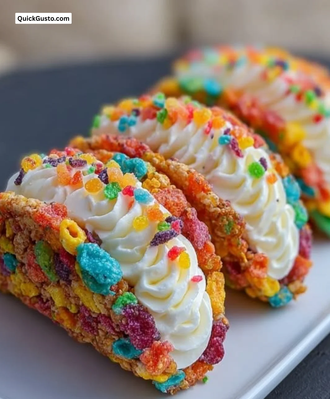 Fruity Pebbles cheesecake tacos with colorful sprinkles and creamy filling