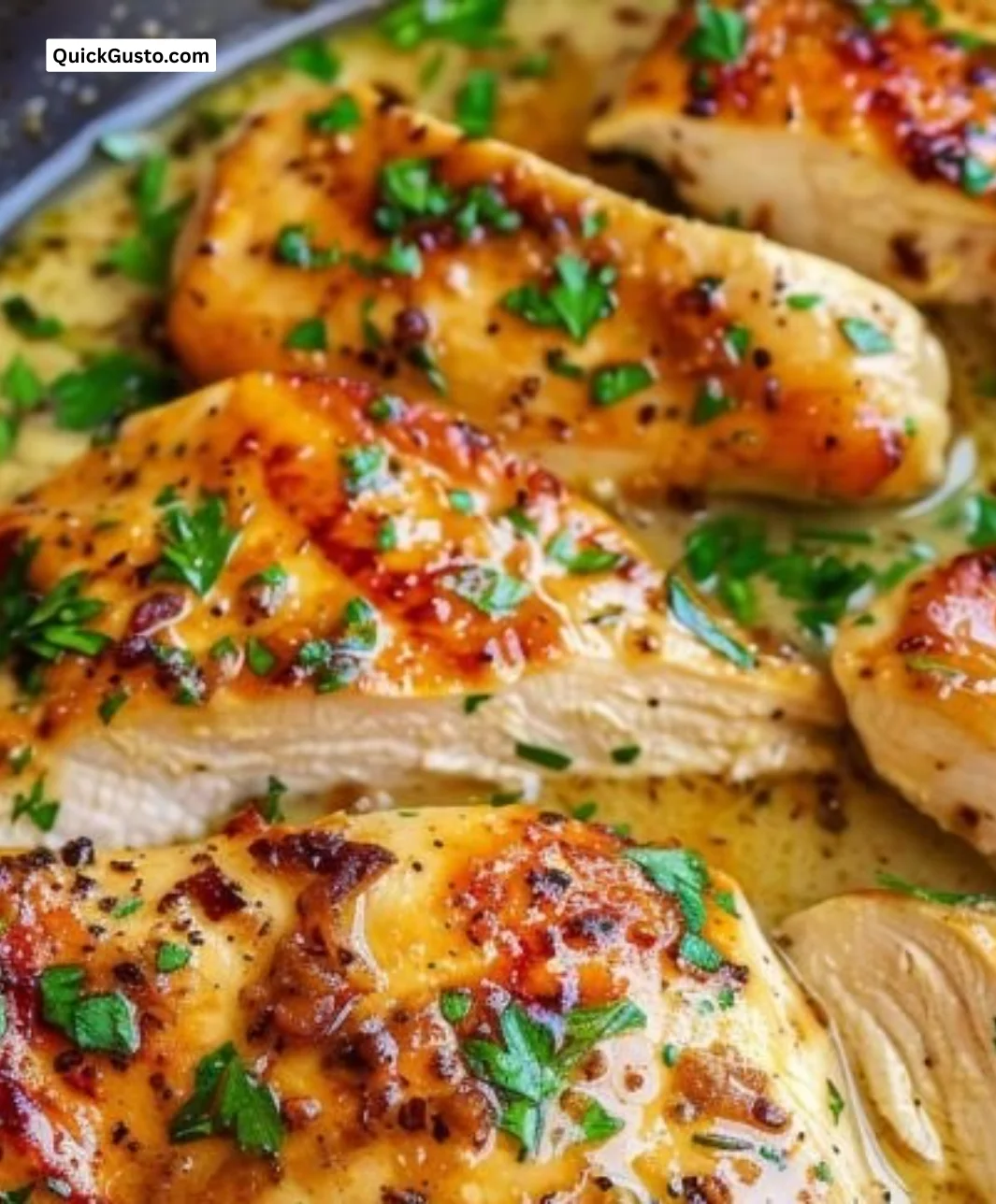 Plate of Garlic Butter Chicken garnished with herbs and served with vegetables
