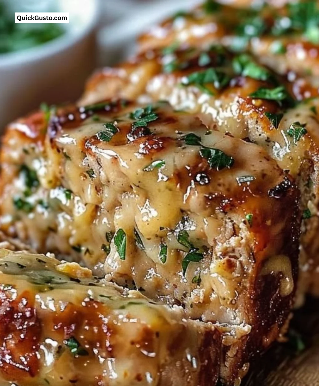 Deliciously baked Garlic Parmesan Chicken Meatloaf served on a plate
