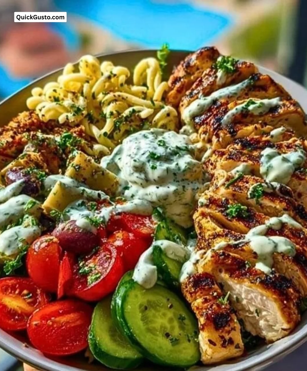 Grilled Chicken Greek Salad with Tzatziki dressing, fresh vegetables, and olives