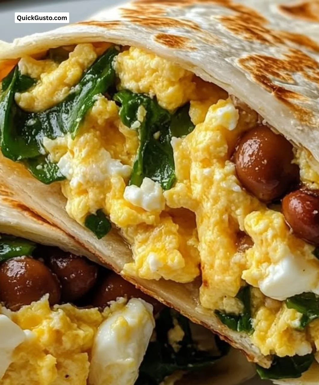 High protein breakfast burrito filled with eggs, veggies, and beans.