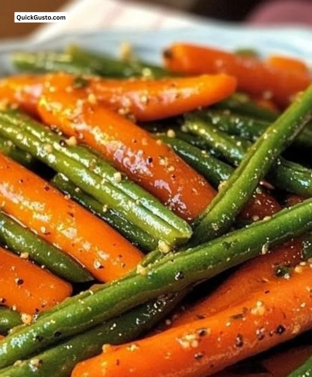 Delicious honey glazed carrots with green beans on a plate