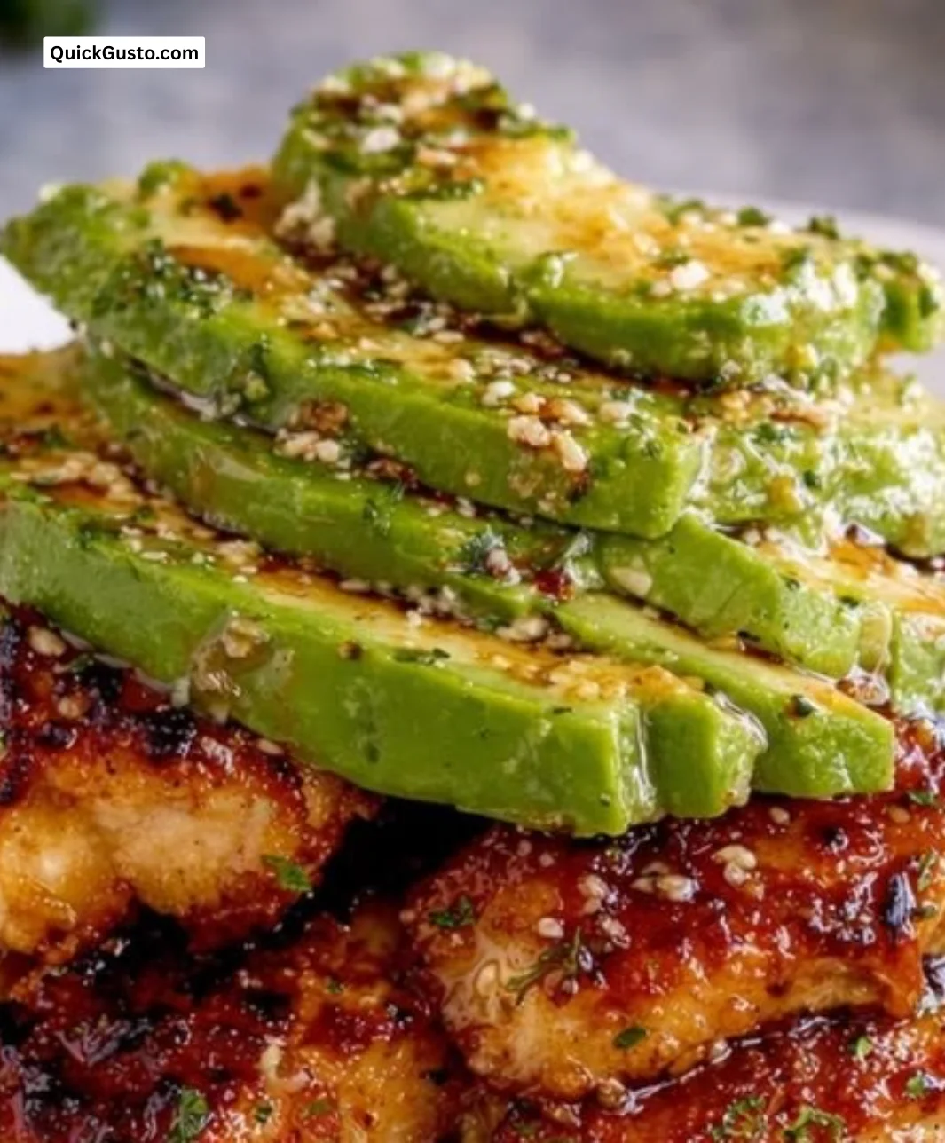 Honey Lime Chicken stacked with avocado rice, garnished for a flavorful dish.