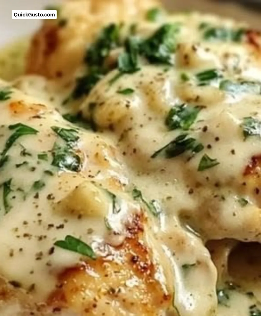 Instant Pot Garlic Parmesan Chicken served on a plate with herbs