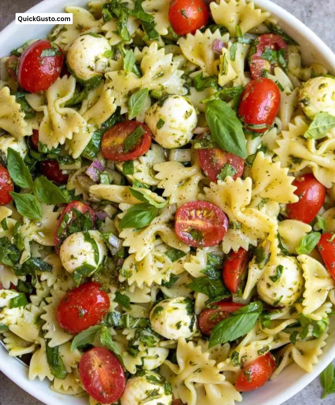 Colorful Italian Bow Tie Pasta Salad with fresh vegetables and dressing