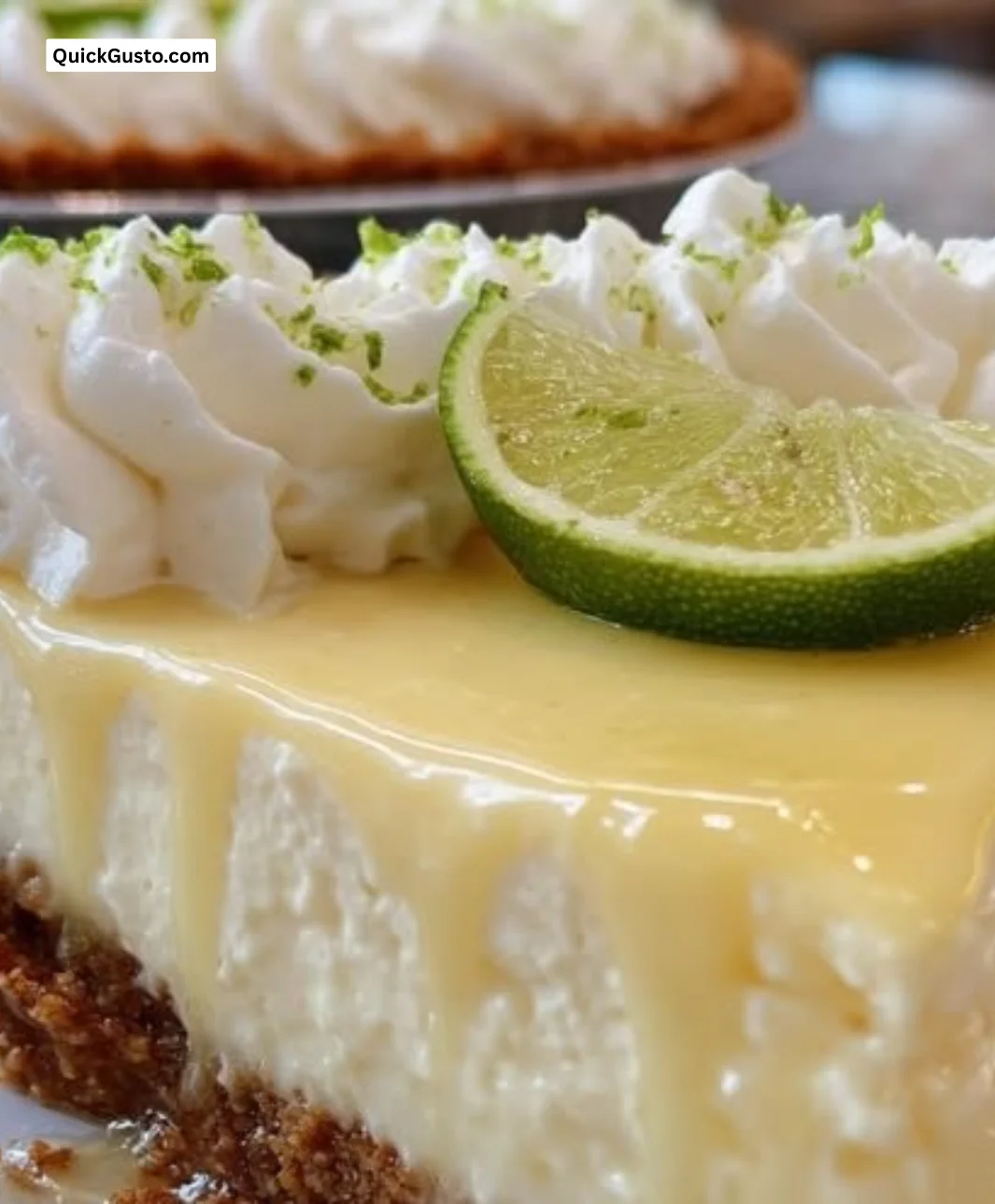 A slice of key lime pie with a creamy filling and graham cracker crust