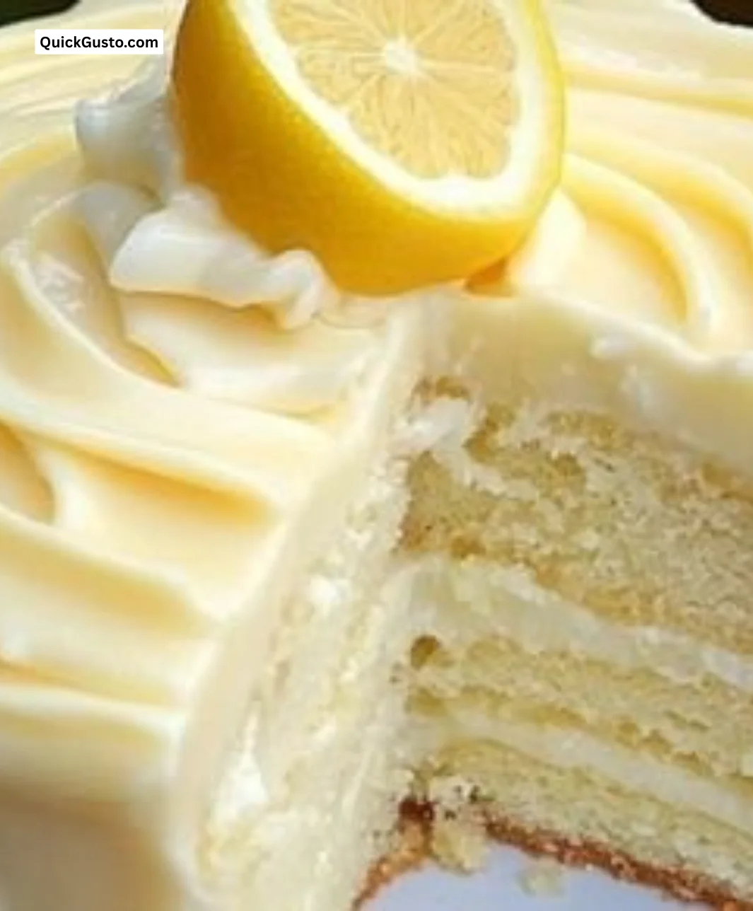 Delicious lemon cheesecake slice on a plate garnished with lemon zest.