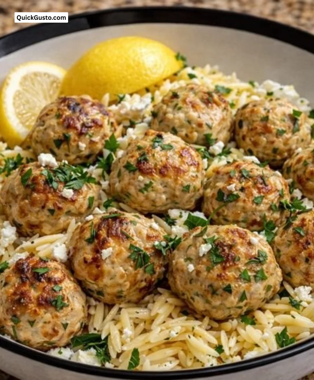 Lemon-Kissed Greek Chicken Meatballs served with Orzo on a plate