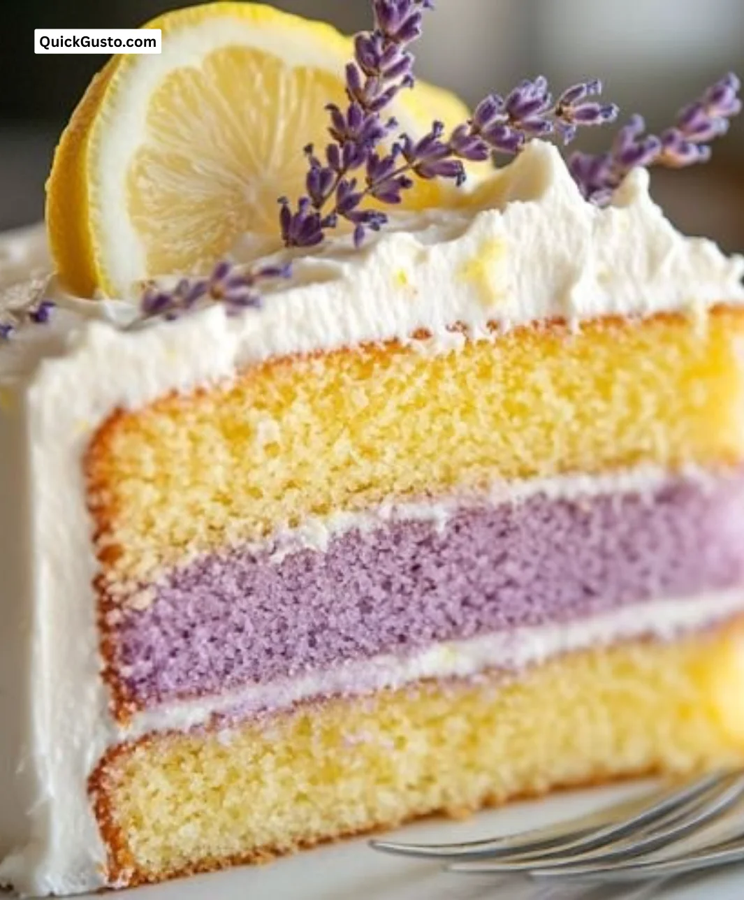 Lemon Lavender Cake with slice showcasing vibrant lemon and lavender flavors