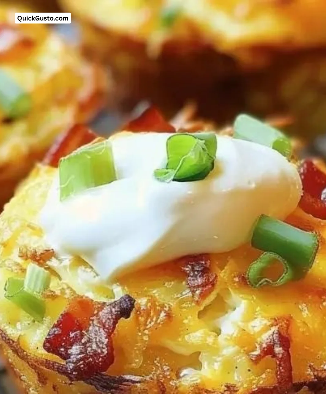 Loaded bacon and egg muffins served on a plate with crispy hash browns