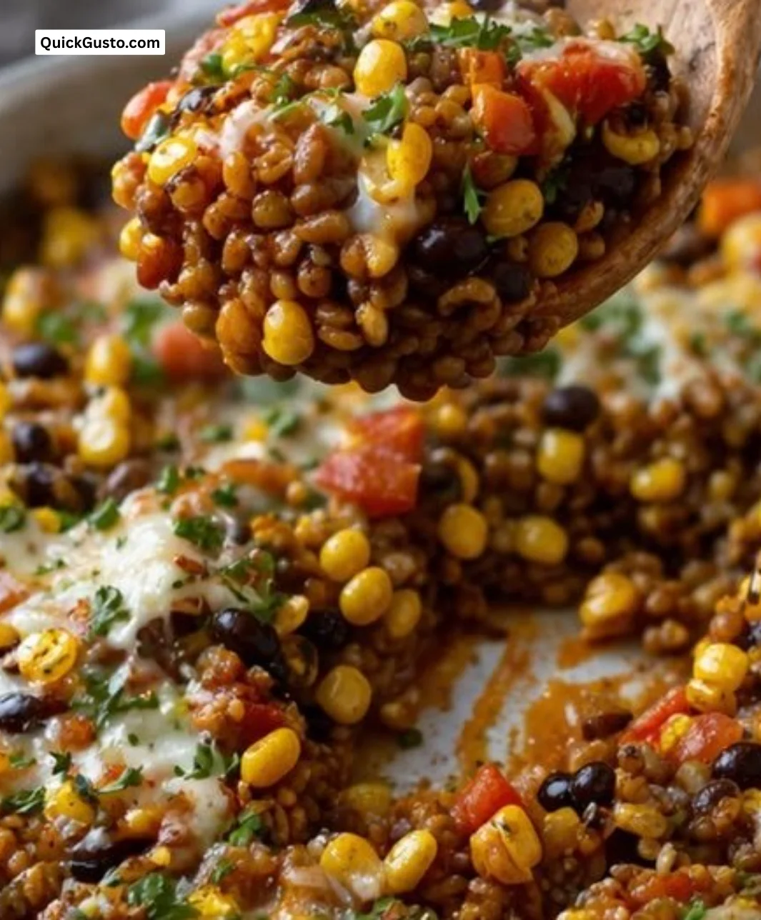 Bowl of Mexican lentils garnished with fresh cilantro and lime.
