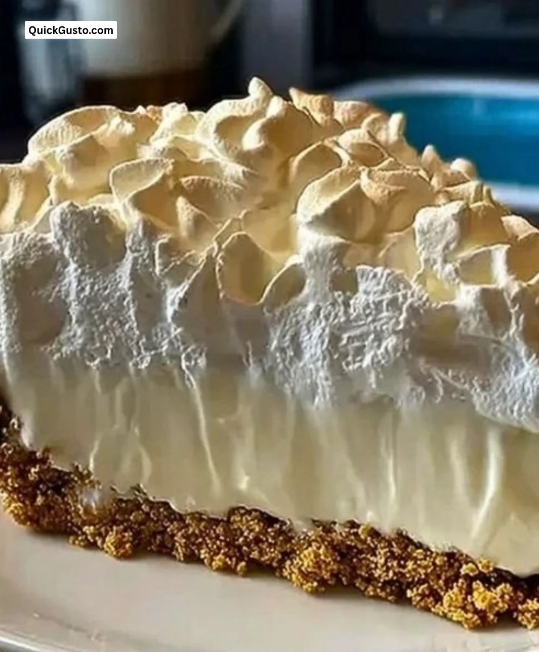 No-bake marshmallow cheesecake topped with whipped cream and marshmallows