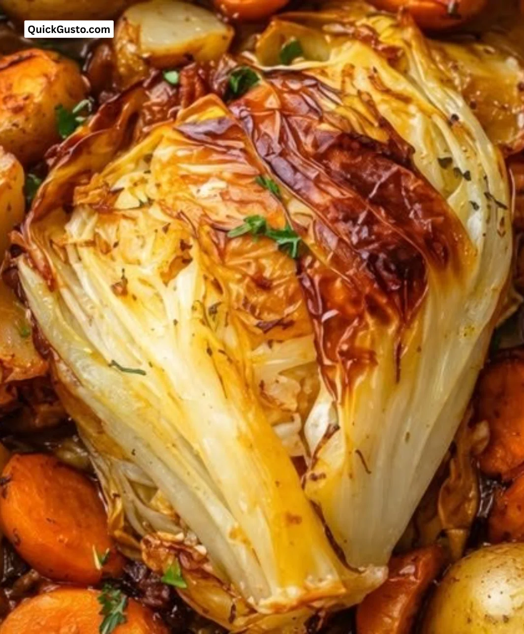 One-pan oven roasted cabbage with potatoes and carrots for a delicious comfort meal.