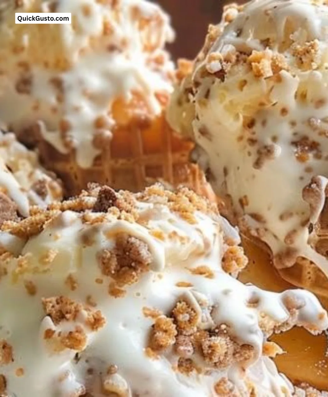 Delicious peach cobbler cheesecake cones topped with fresh peaches and crumbly crust