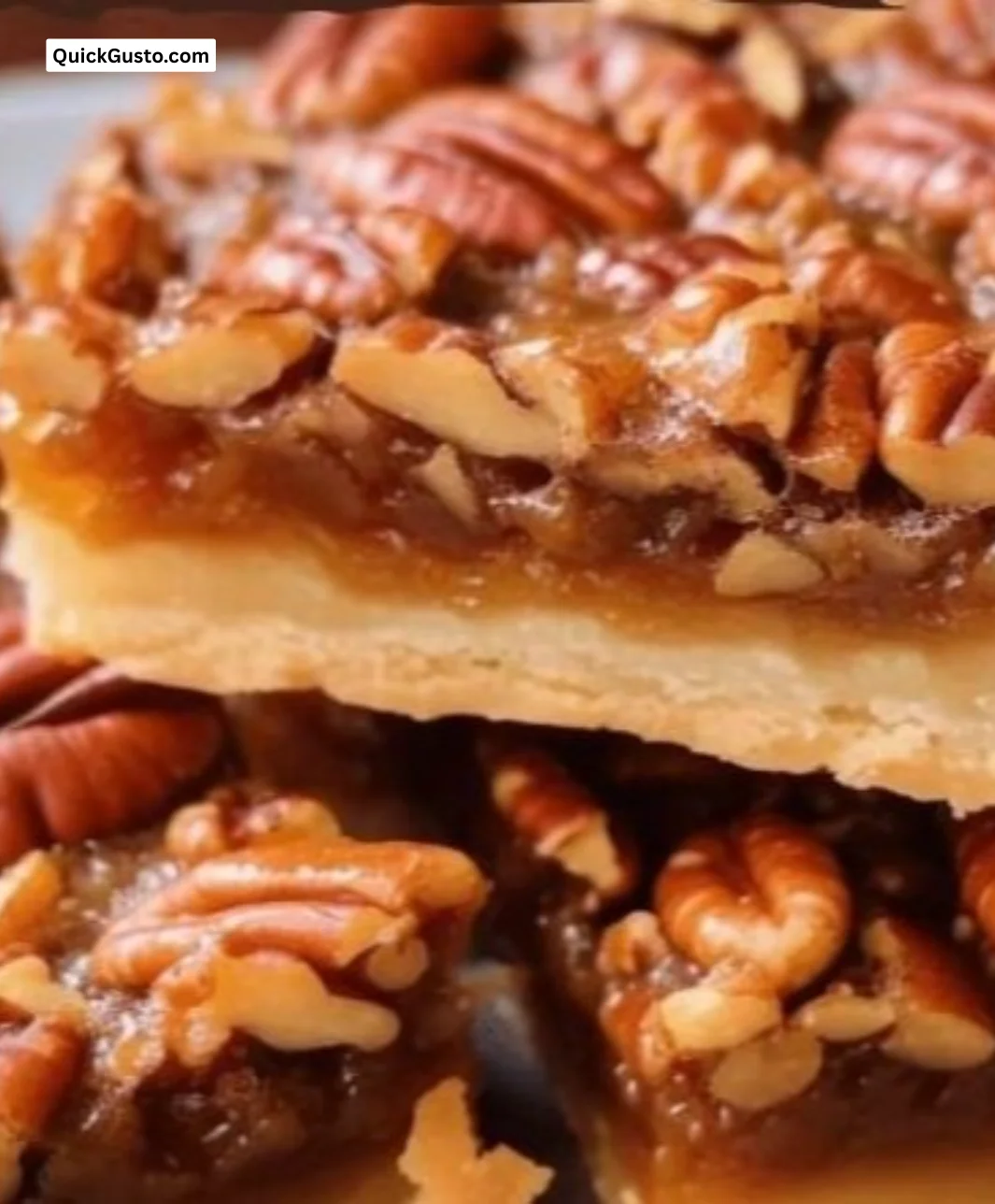 Delicious pecan pie bars on a plate, featuring a rich pecan filling and a golden crust.