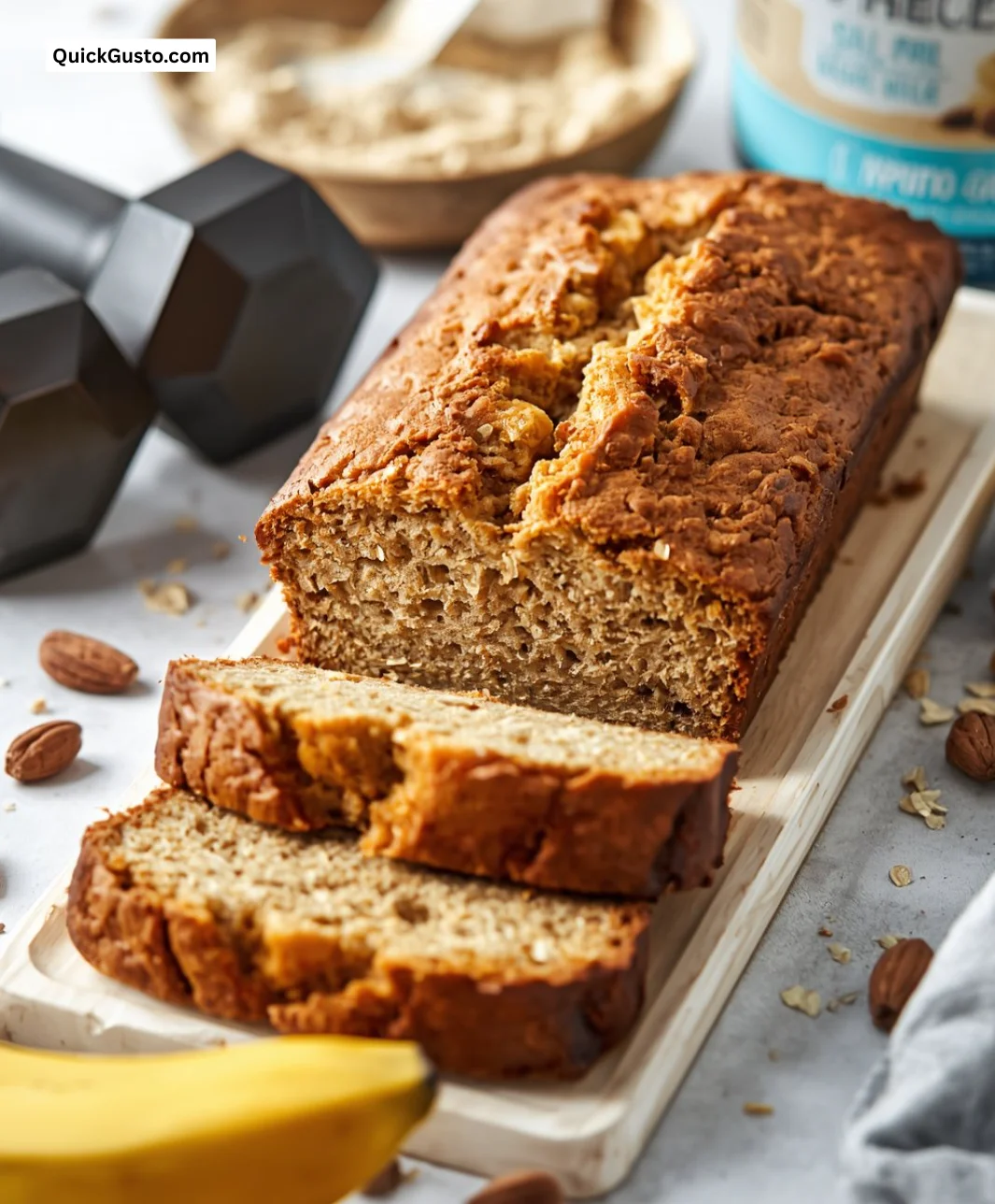 Delicious slice of perfected banana bread on a wooden cutting board