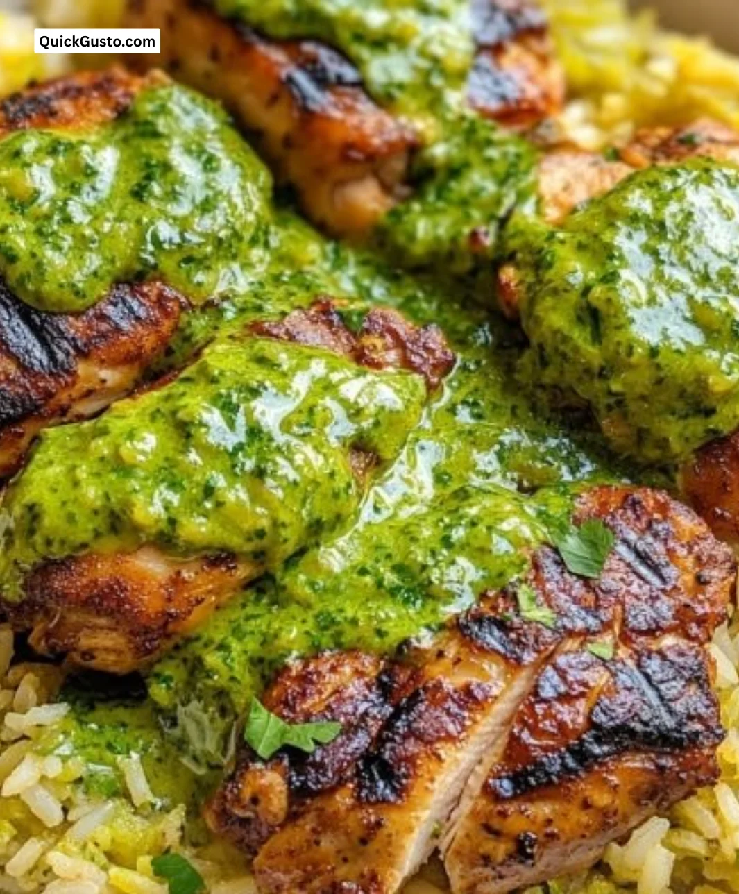 Plate of Peruvian chicken and rice served with fresh green sauce