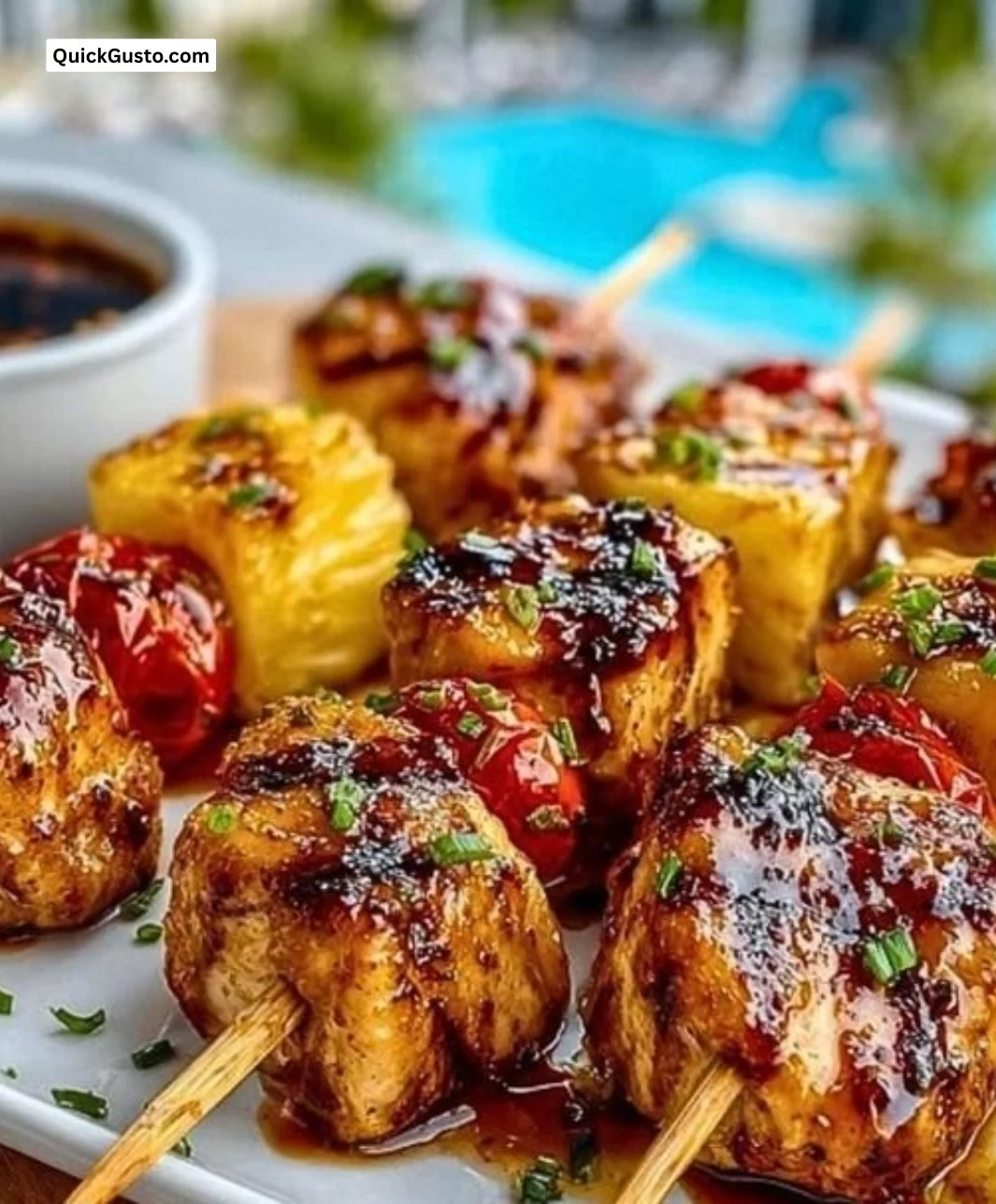 Delicious pineapple chicken kabobs on the grill with colorful vegetables.