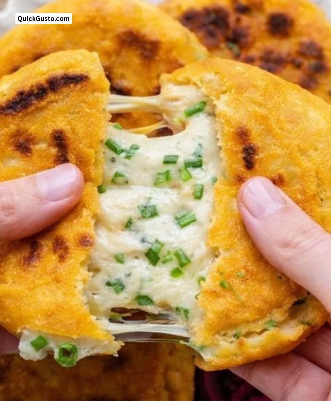 Delicious pupusas filled with cheese and beans served on a plate.